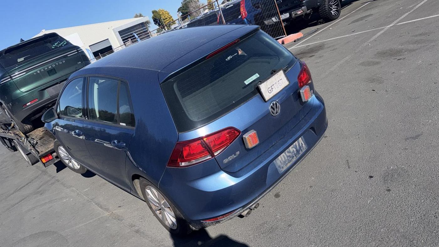 Blue VW Golf loaded for wrecking and parts recovery at the yard